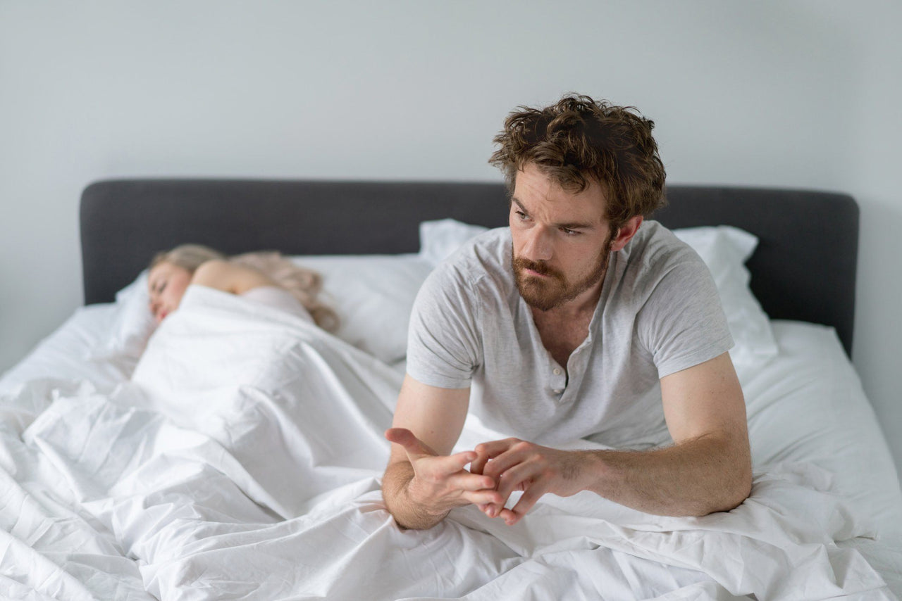 man wondering what to do when you wake up in the middle of the night