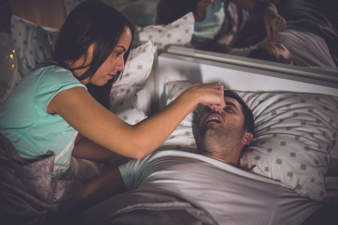 woman can't sleep when her partner snores