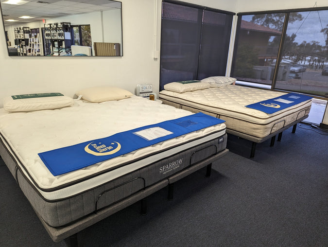 Inside the Yawnder showroom, the nest bedding sparrow signature hybrid and owl natural latex hybrid mattresses are displayed