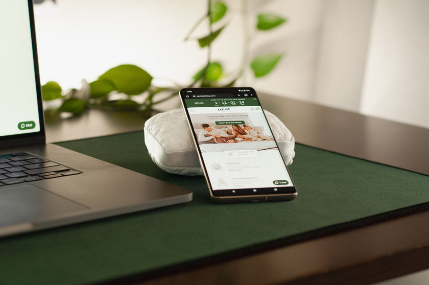 A Mini Easy Breather Pillow with a cell phone resting on it