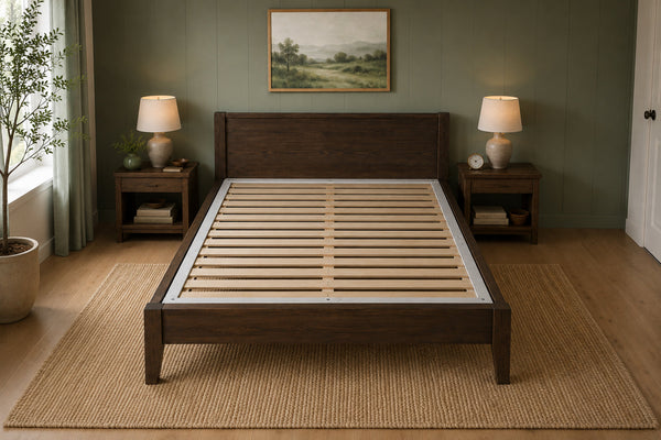 Bunkie Board wooden slats inset into a wooden bed frame in a bedroom with lamps and a painting on the wall.