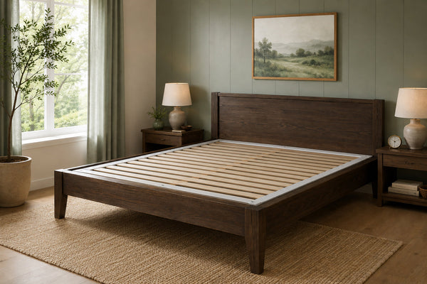 Bunkie Board wooden slats inset into a wooden bed frame in a bedroom with a window, lamps, and a painting.