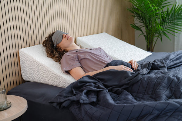 Woman lying on shaped foam pillow