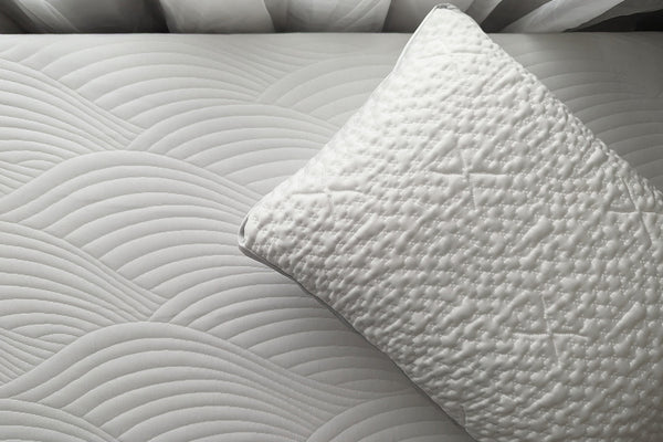 an easy breather jr pillow on top of the cooling topper