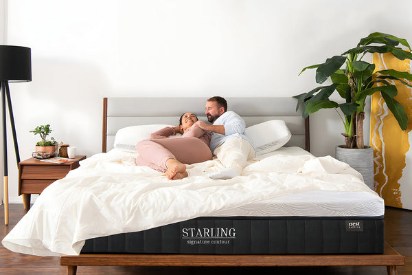 Couple laying on nest bedding Starling mattress