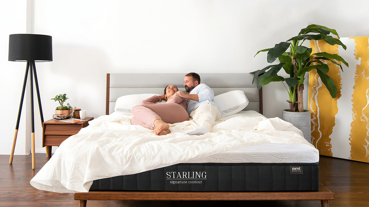Couple laying on nest bedding Starling mattress