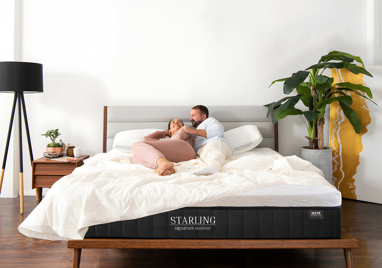 Couple laying on nest bedding Starling mattress