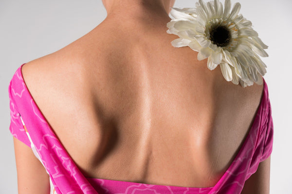 back of woman sleeping with scoliosis