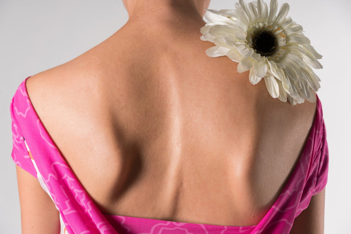 back of woman sleeping with scoliosis