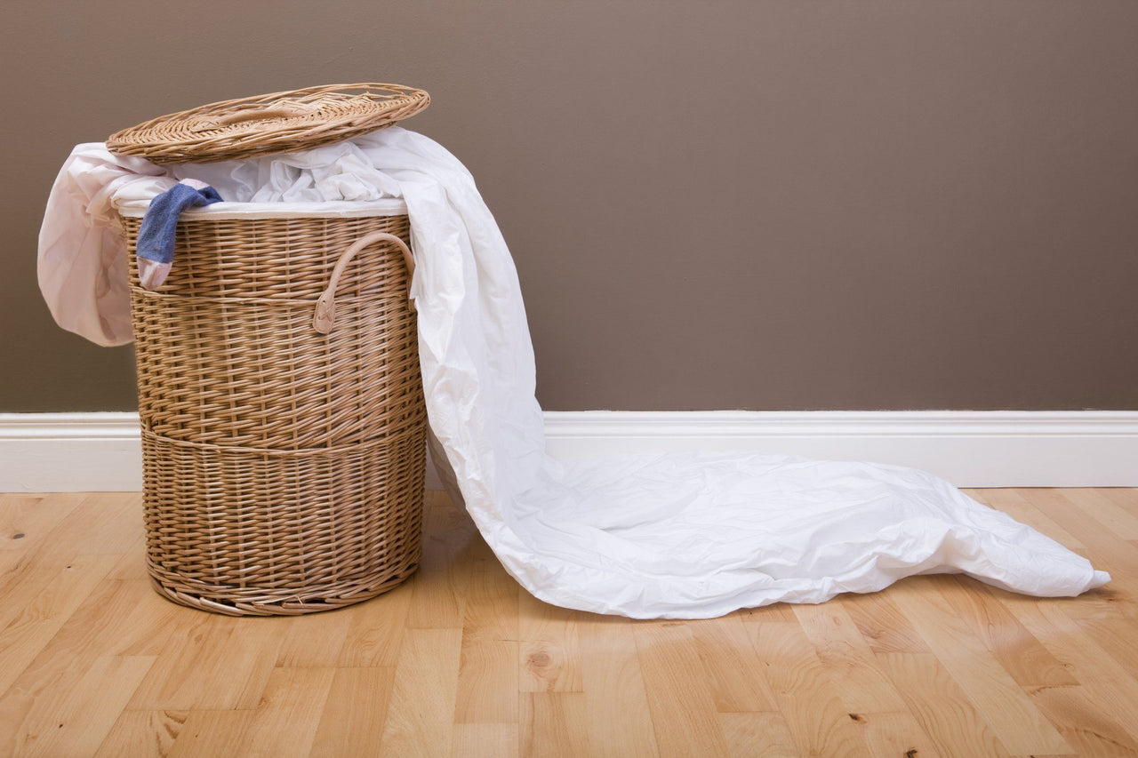 ways to recycle an old bed sheet in the laundry hamper
