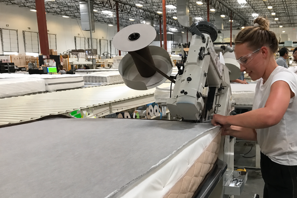 Brooke Alexander manufacturing a mattress in the factory