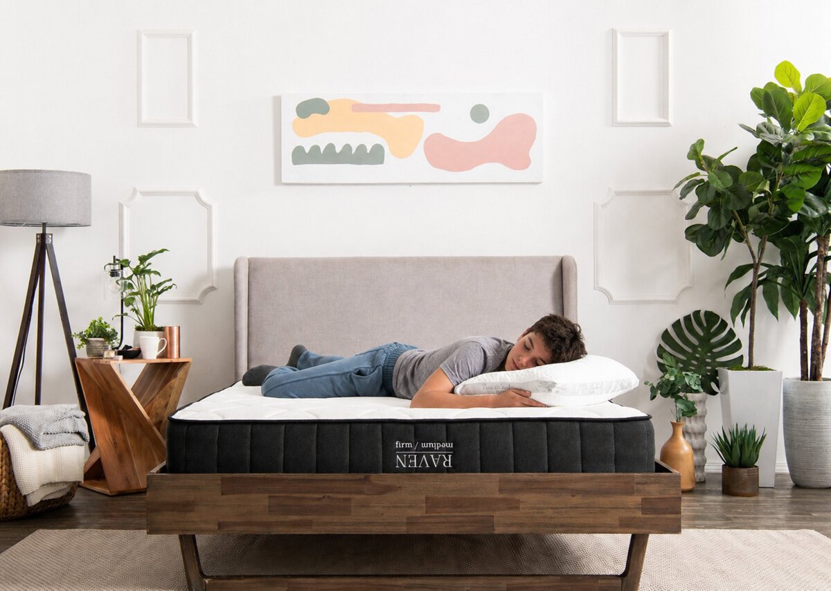 a young man sleeping on the raven mattress