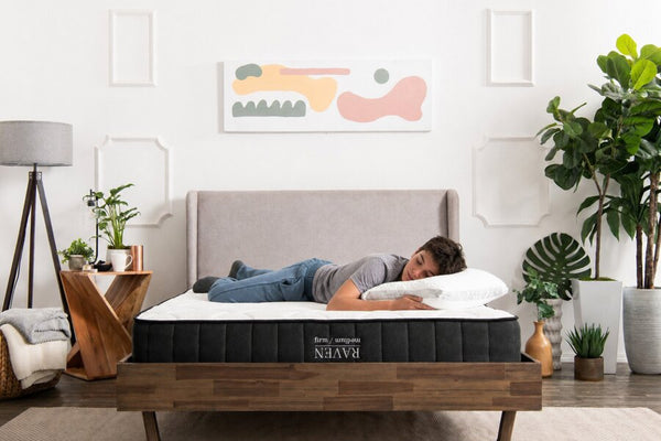 Child resting on the Raven Hybrid mattress with an Easy Breather pillow