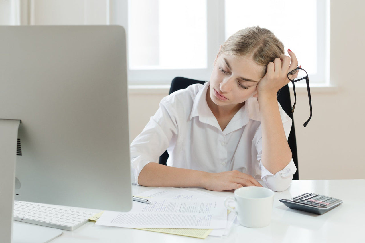 businesswoman suffering from sleep disorders at work