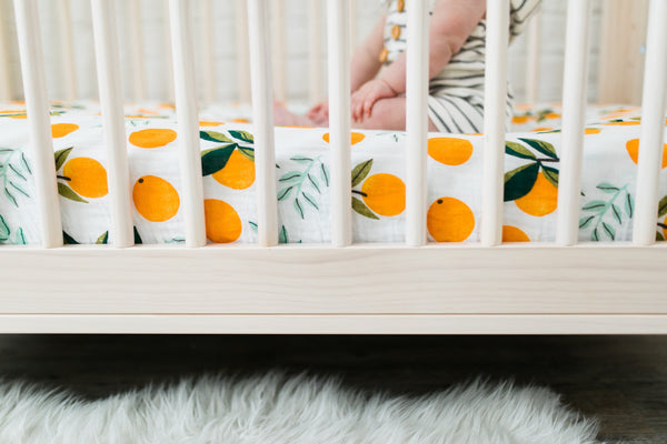 clementine kids clementine crib sheet closeup citrus pattern inside of crib bed