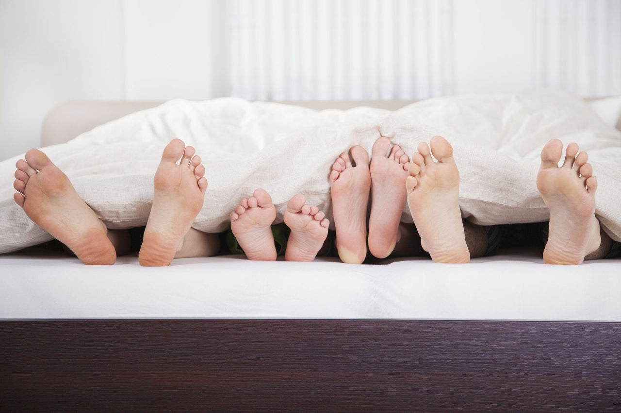 how much sleep is healthy for a family sticking feet out from under the blanket