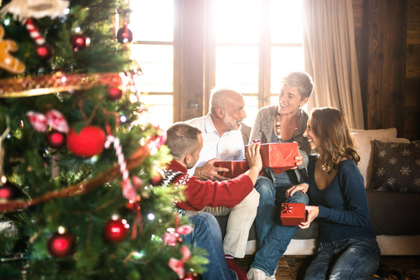 family opening presents holiday bedding gift ideas