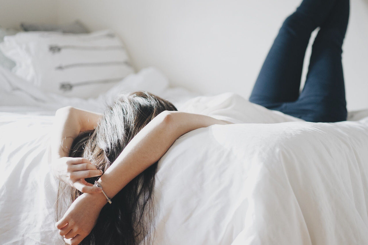 woman on bed sleeping 