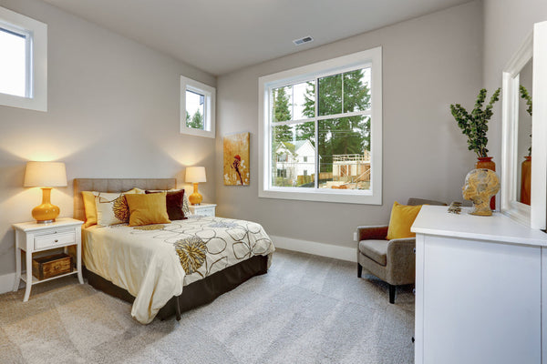 Guest room bedroom with fully made bed