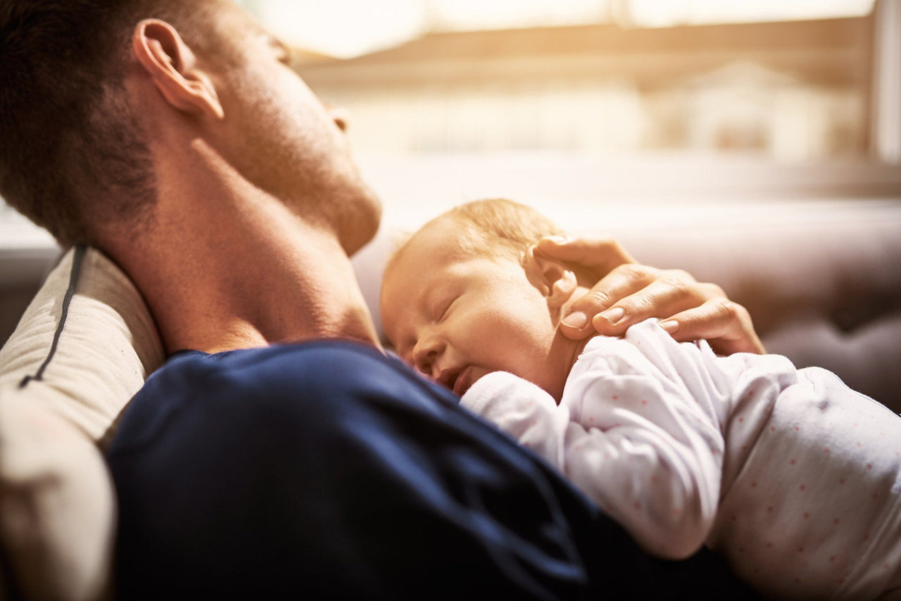 Father and newborn coping with sleep deprivation