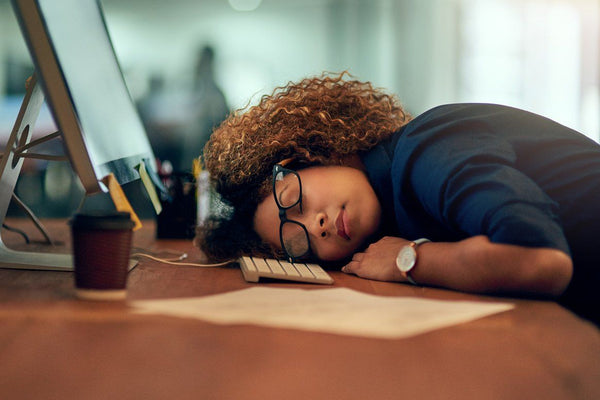 Businesswoman tired at work should fix your sleep schedule