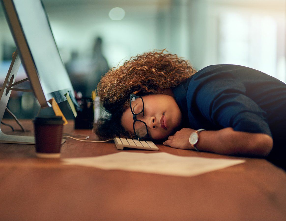 Businesswoman tired at work should fix your sleep schedule