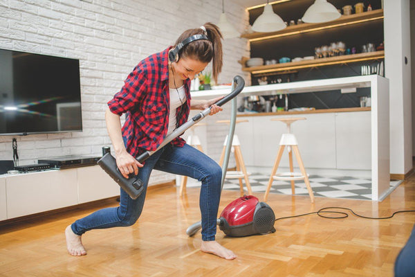 Woman cleaning the house when she just can't sleep at night