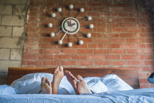 Couple's feet poking out of the perfect sleep environment