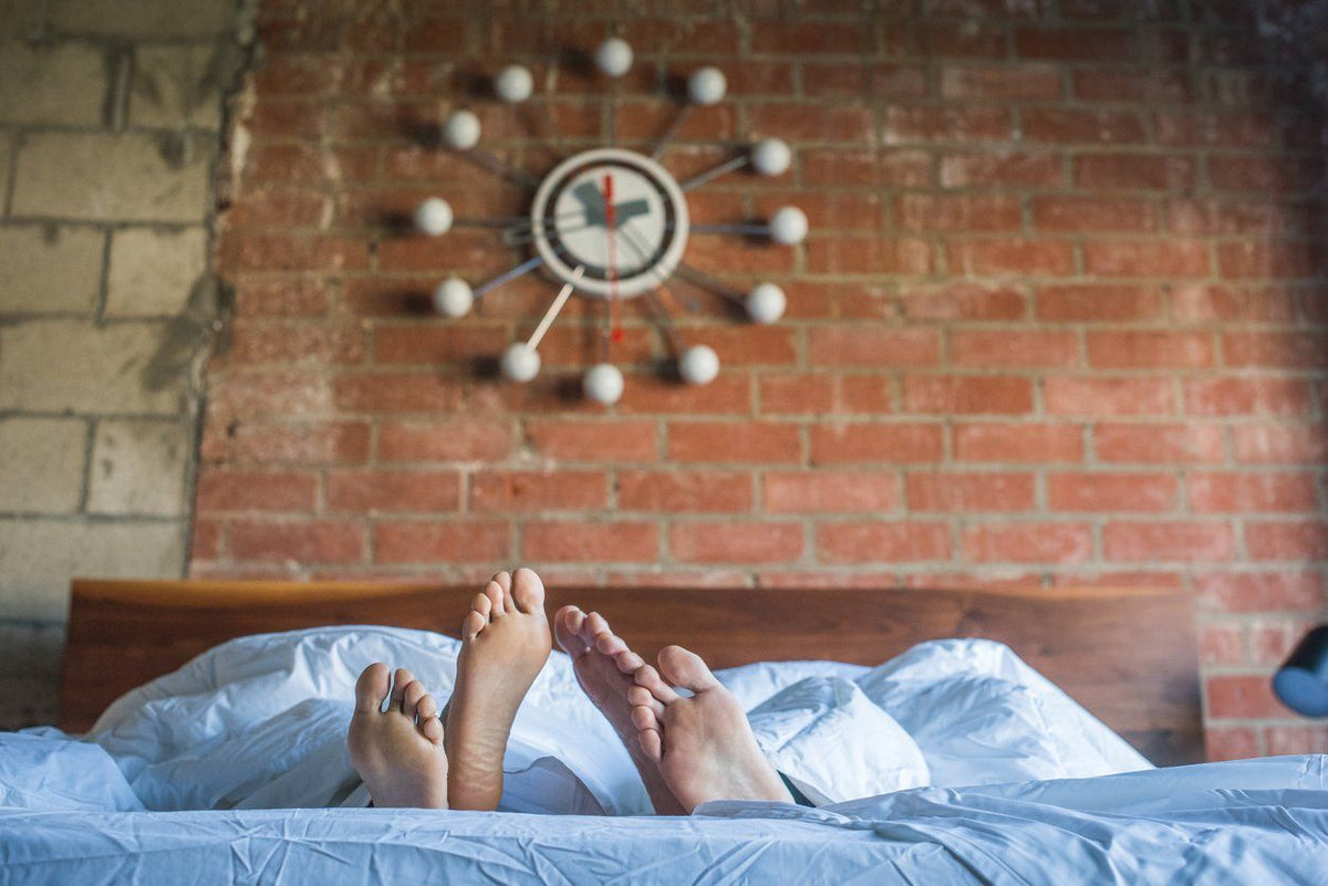 Couple's feet poking out of the perfect sleep environment
