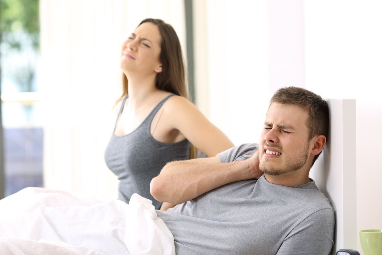 Couple with morning aches and pains