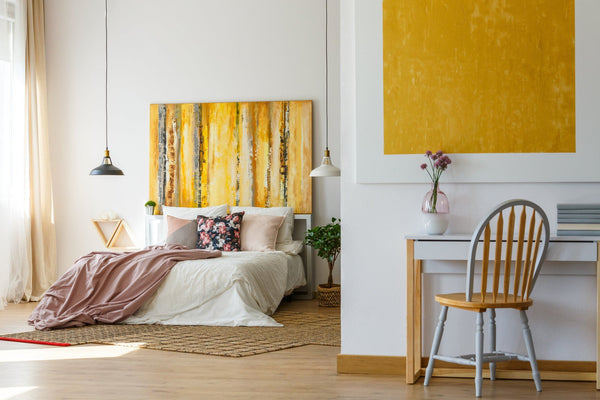 create a luxurious guest bedroom with a seating area
