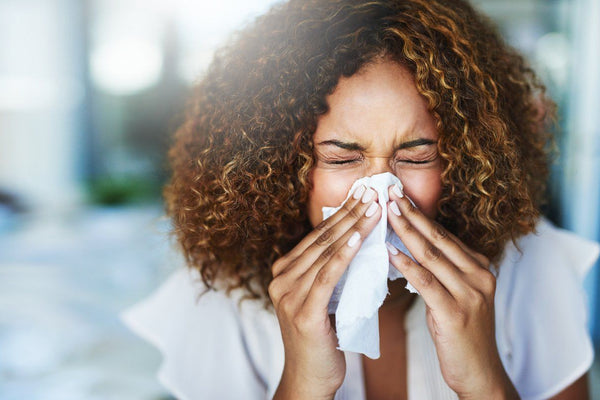 Woman sneezing