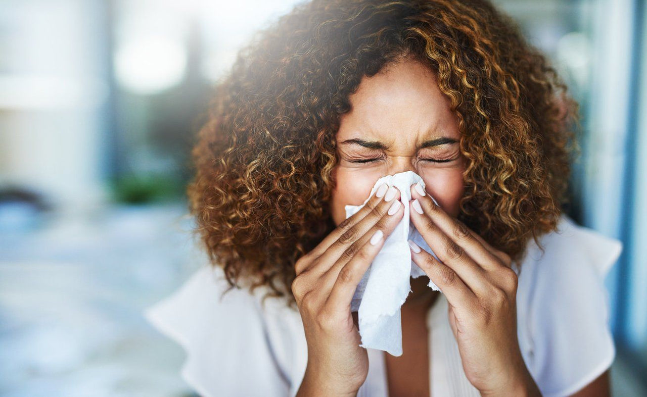 Woman sneezing