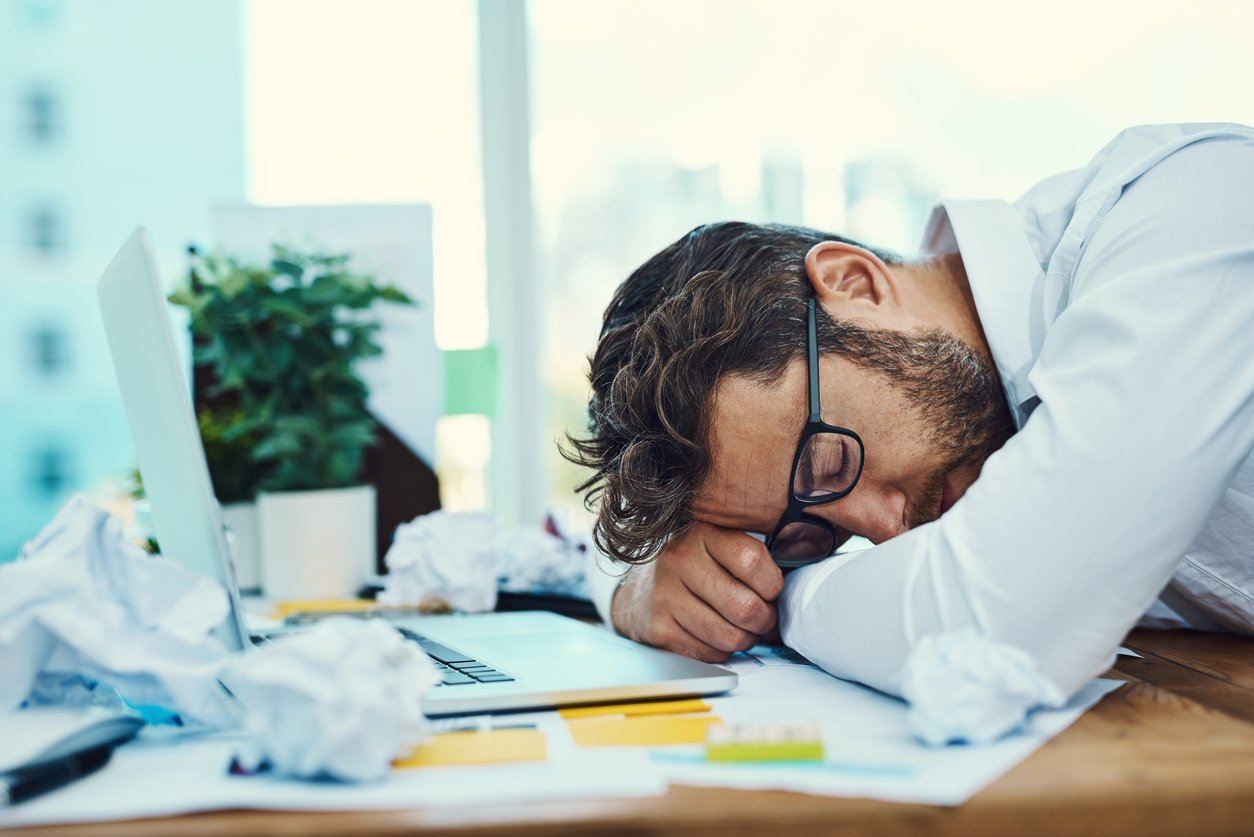 Employee sleeping at desk needs a good night's sleep