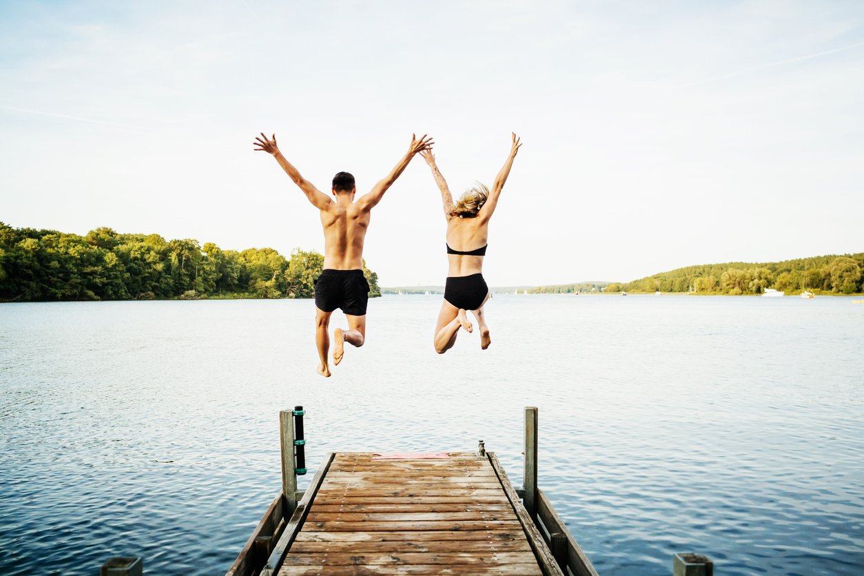 Friends jump into water after a healthy diet and sleep