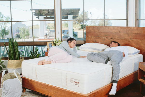 Couple lying down on a bed