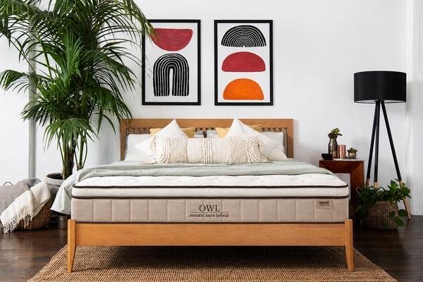 owl mattress in bedroom with bedspread 