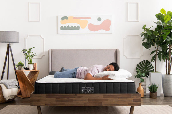 man sleeping on Raven Mattress firm side
