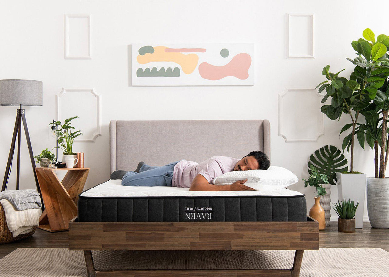 man sleeping on Raven Mattress firm side