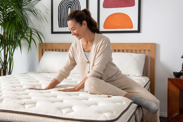 Woman feeling mattress 