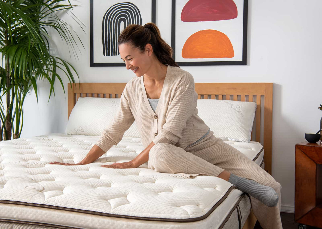 Woman feeling mattress 