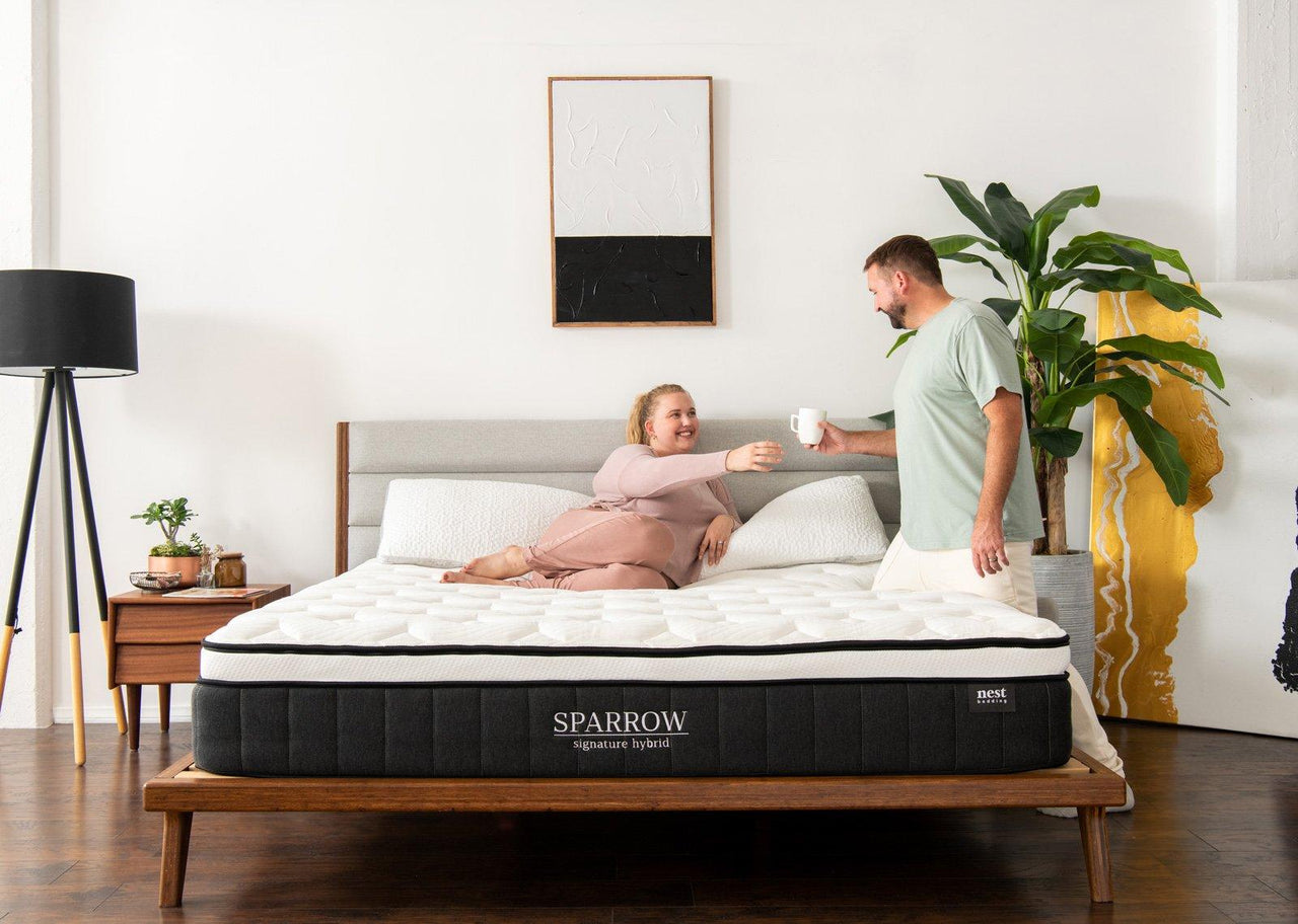 Couple on Sparrow Mattress sharing a cup of coffee