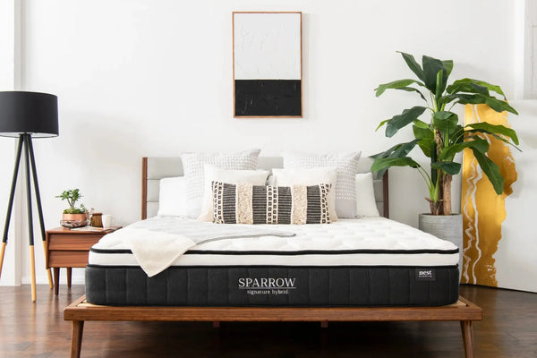 sparrow mattress sitting on bamboo bed frame in bedroom 