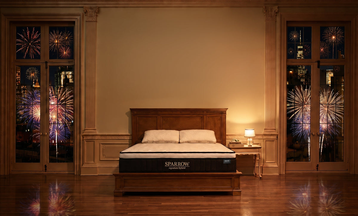 sparrow mattress in a luxury bedroom with fireworks all around outside the windows