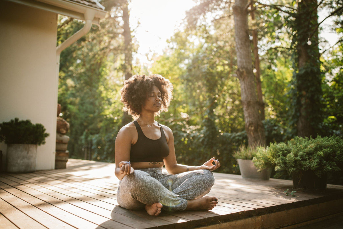 woman practicing yoga philosophy outside