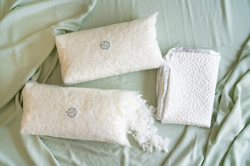 Two bags of easy breather shredded foam fill and a folded easy breather pillow cover