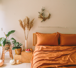 sateen organic cotton terracotta sheets in a beautiful bedroom scene