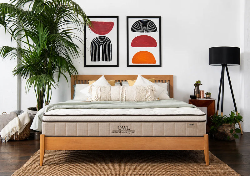 owl mattress in bedroom with bedspread 