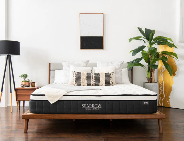 sparrow mattress sitting on bamboo bed frame in bedroom 