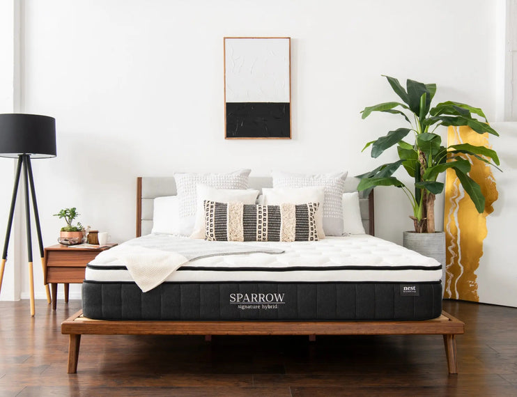 sparrow mattress sitting on bamboo bed frame in bedroom 